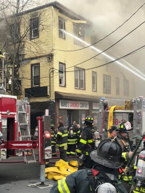 New Update: Four-Alarm Fire Destroys Building With Businesses, Apartments In Area