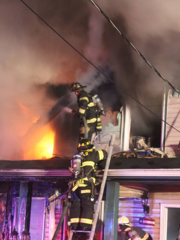 PHOTOS: Car Fire Spreads To Garfield Home