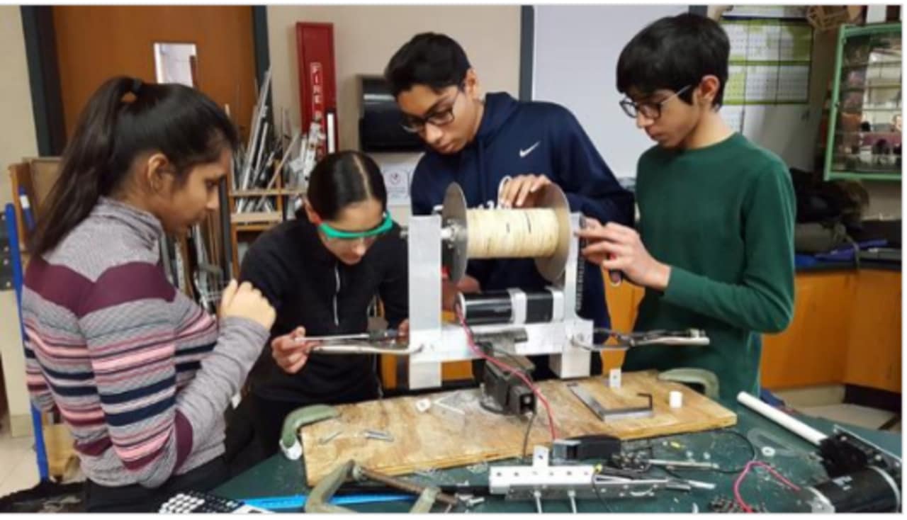 Members of The Ossining O-Bots work on a creation they hope will win them an upcoming tourney in Rockland County and the chance to compete in a worldwide robotics competition this spring.