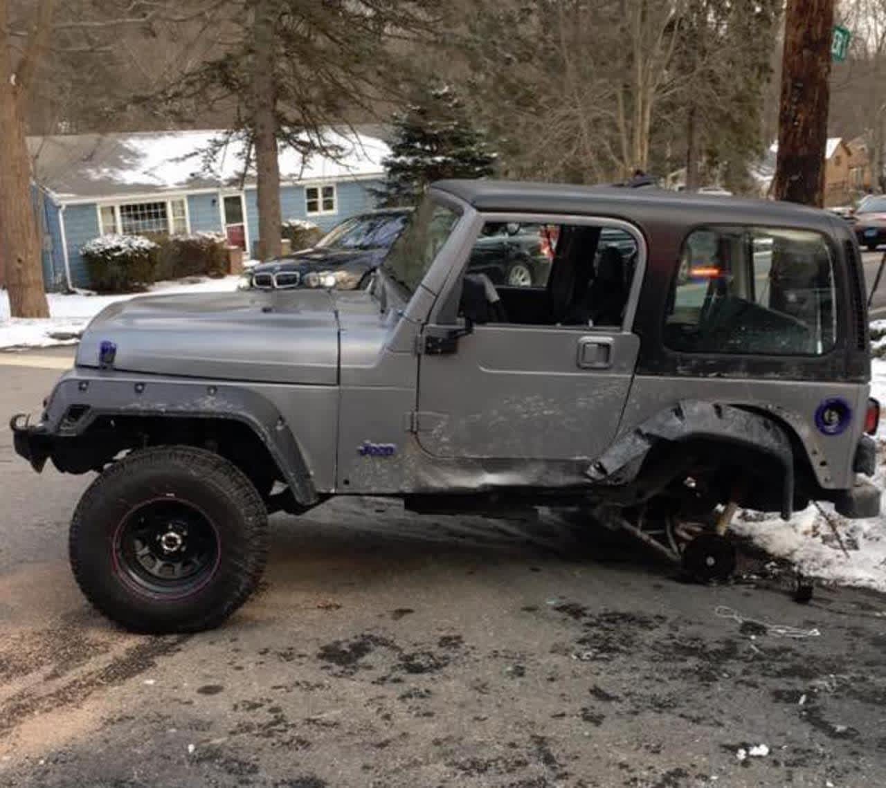 The two-car crash left this jeep without its rear wheels.
