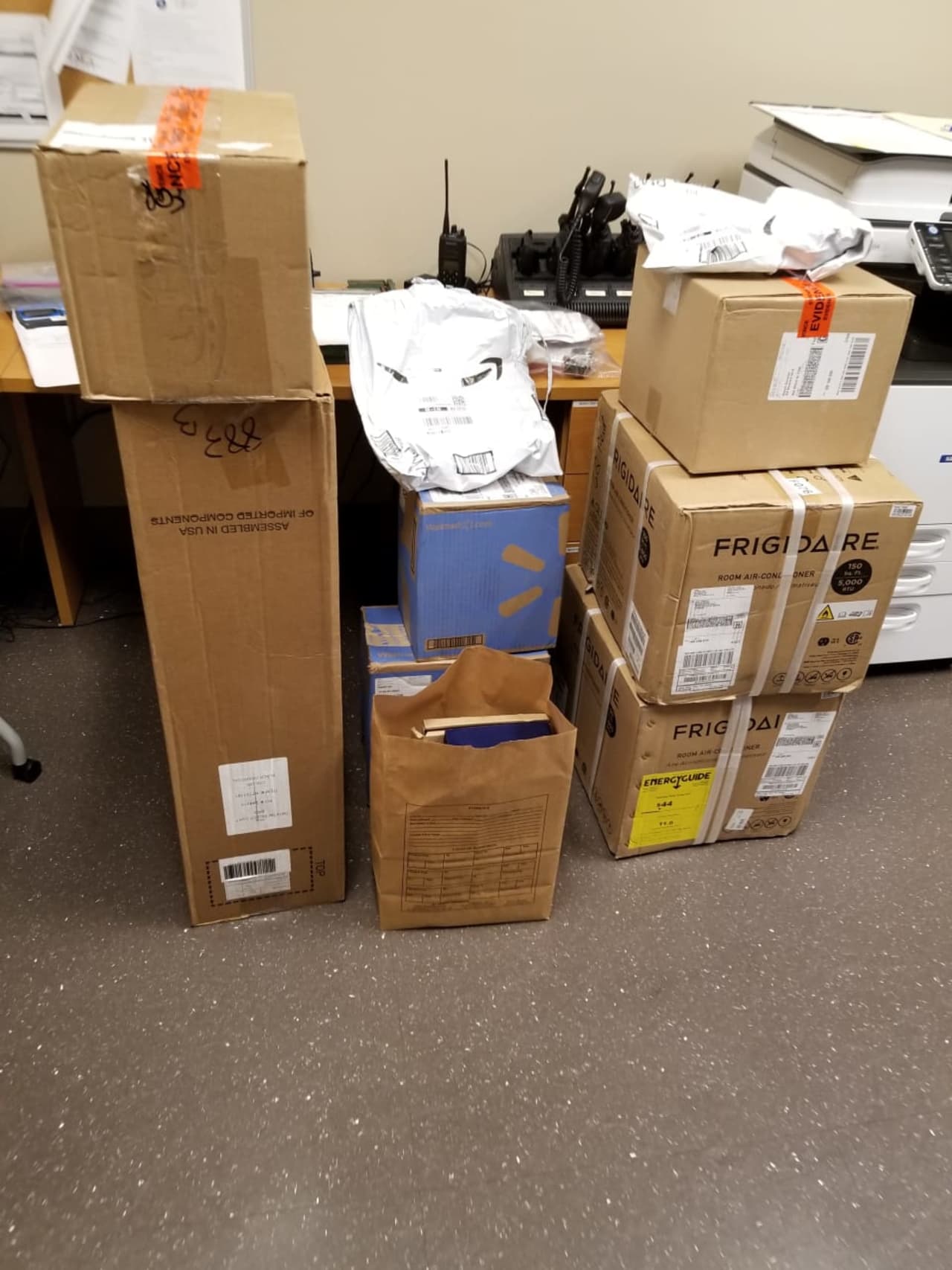 Assortment of stolen packages recovered by New Milford police.