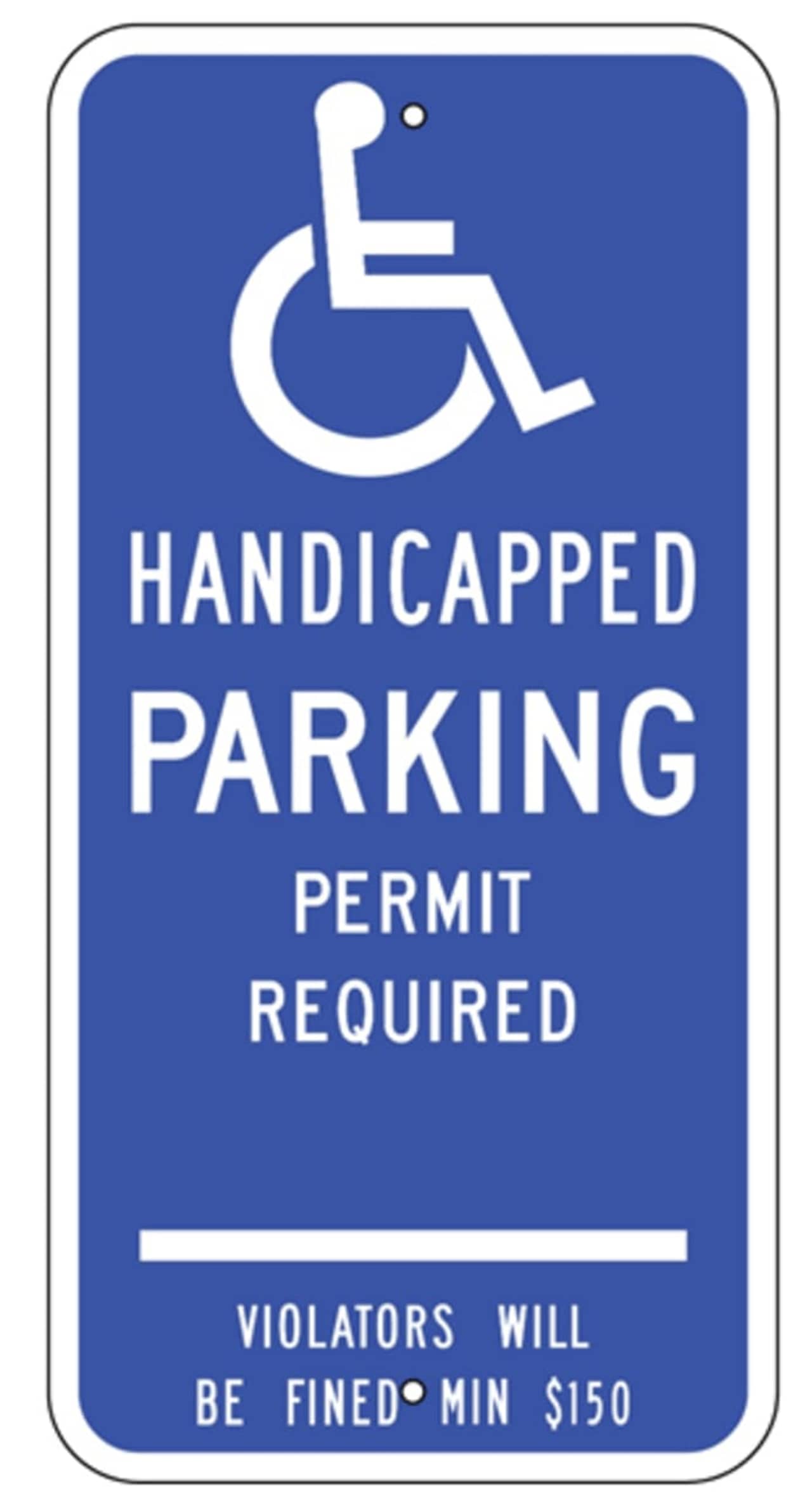 The New Canaan Parking Commission voted in favor of charging handicapped motorists to park in certain lots.