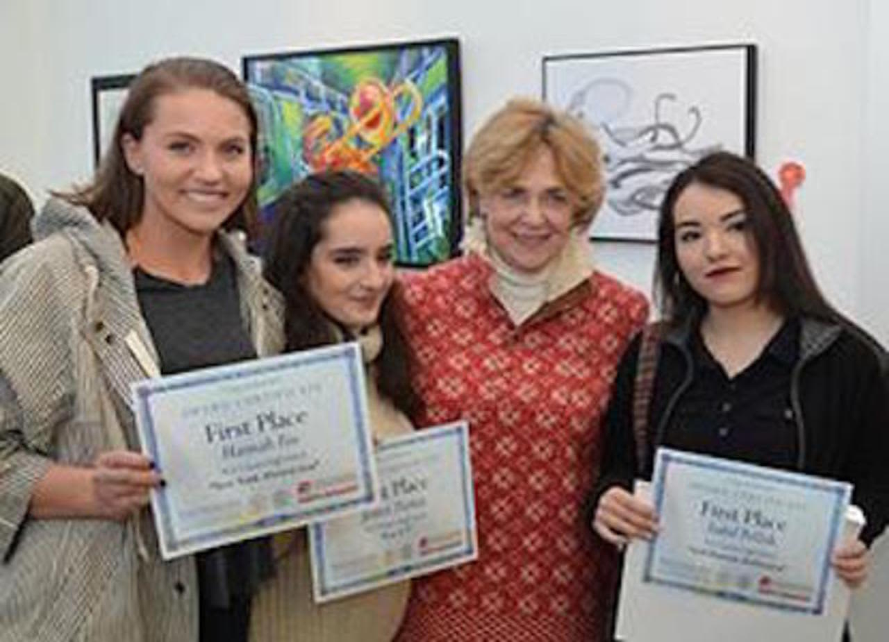 Hannah Fox, Jessica Dantas and Isabel Pollish, with their New Canaan High School teacher Jeanne McDonagh, earned first-place awards for their art work.