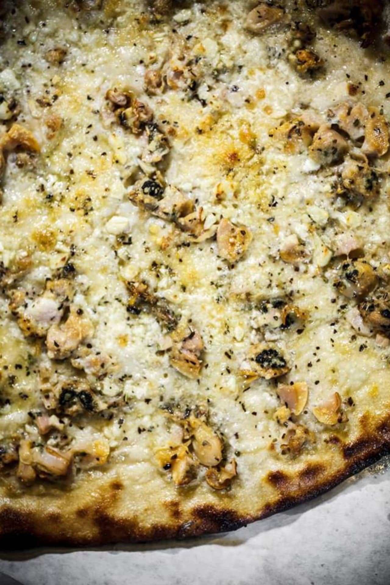 Daily Meal suggests the white clam pie from Frank Pepe's.