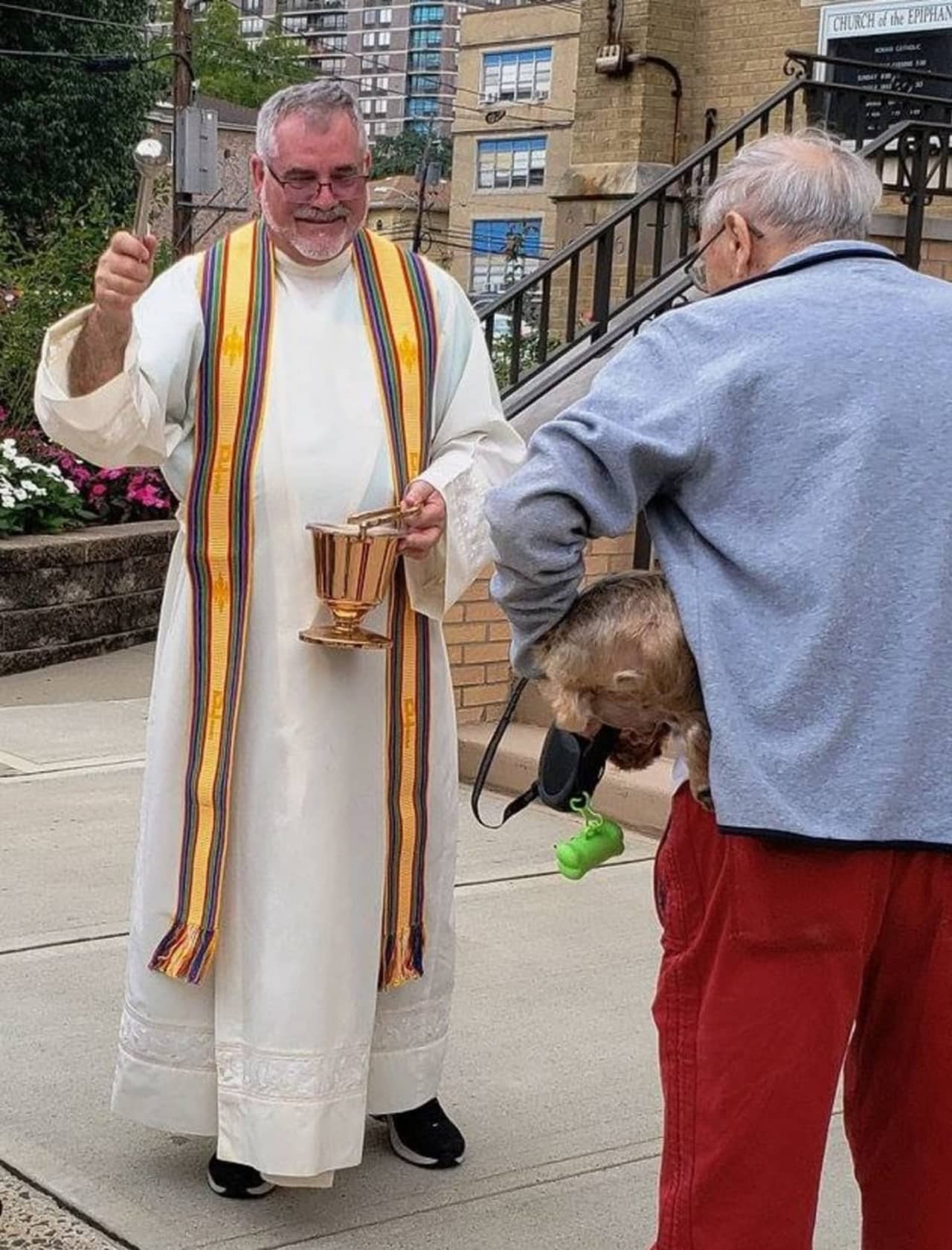 The Rev. Bruce Harger blessing animals during the 2018 Feast of St. Francis of Assisi.