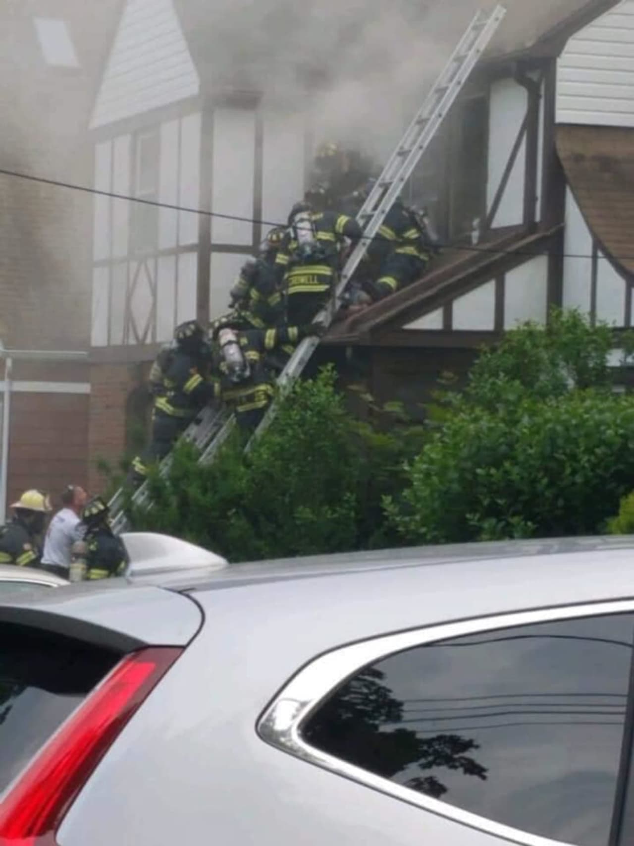 Firefighters at the scene of a deadly blaze in Millburn June 5