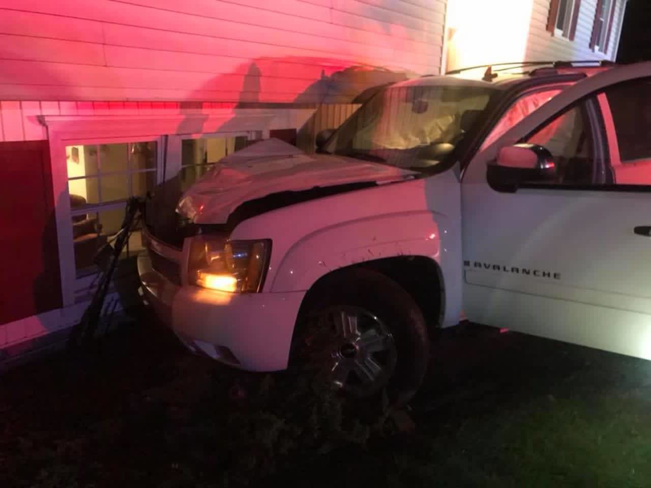 A pickup truck slammed into a home in Monroe.