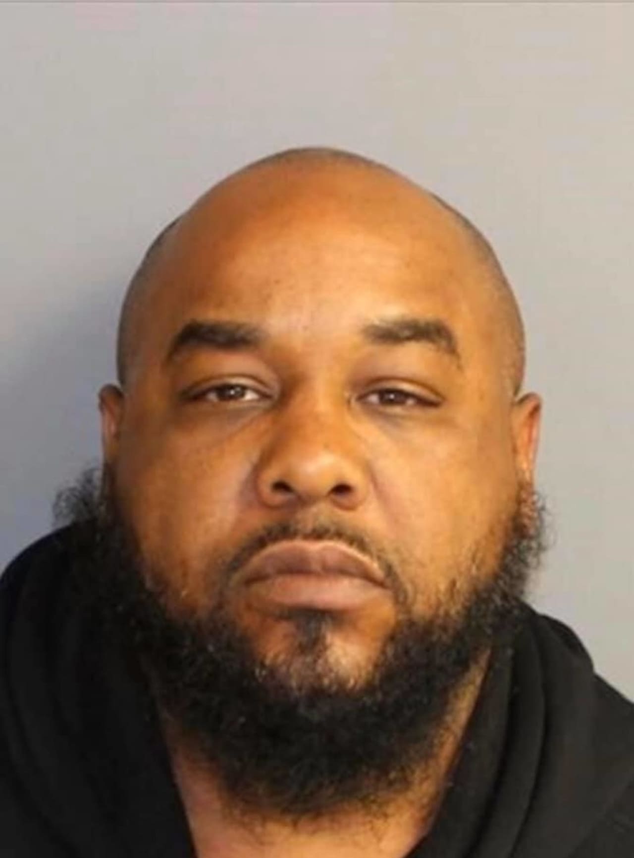 A warrant has been issued for the arrest of Christopher Smith, 41, who is being charged with contempt, violation of a restraining order and burglary, police say.