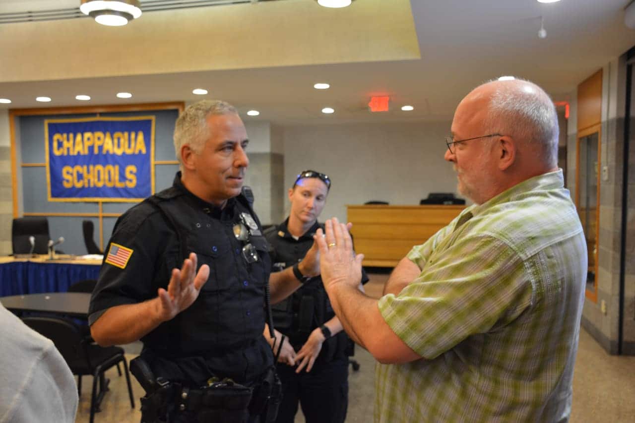 New Castle Police meet with Will Wedge following his interruption of a Chappaqua school board meeting.