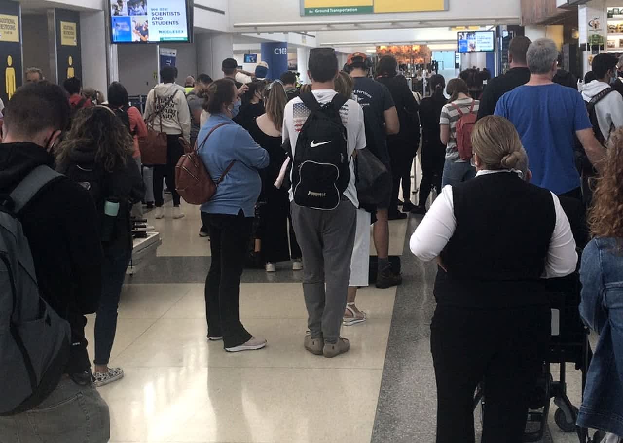 Travelers at Newark Airport's Terminal C await word.