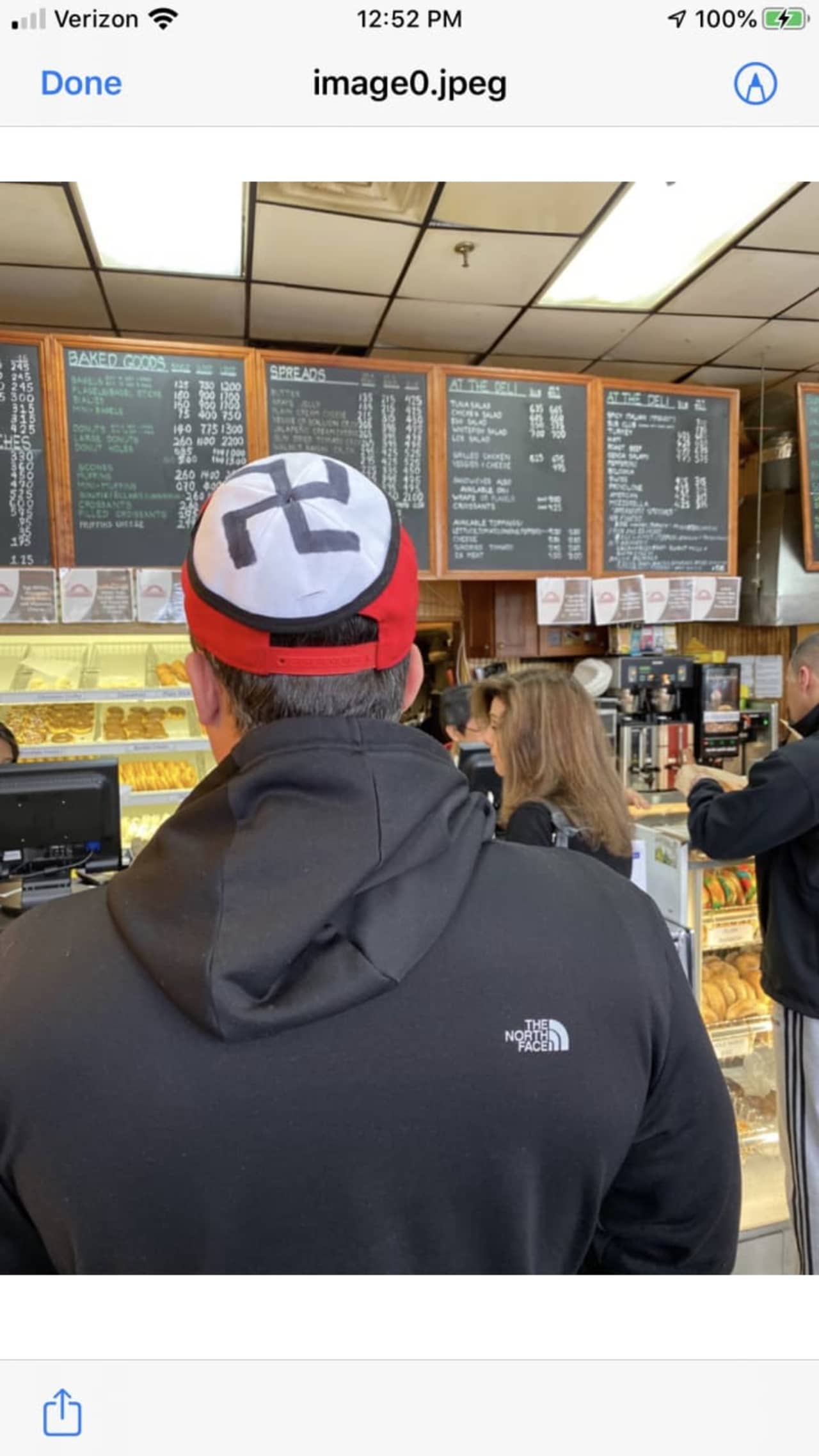 A man wearing a swastika on his hat was escorted off the property of a White Plains diner.