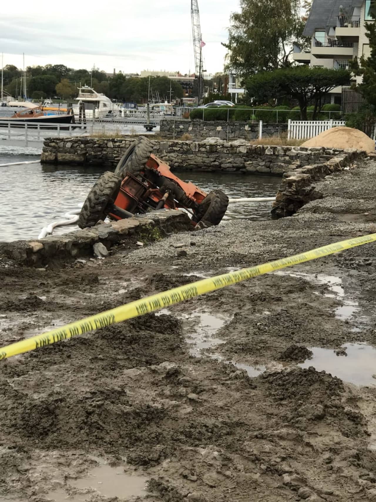 A forklift operator was a little wet, but unharmed after a seawall collapse sent the machine into the water.