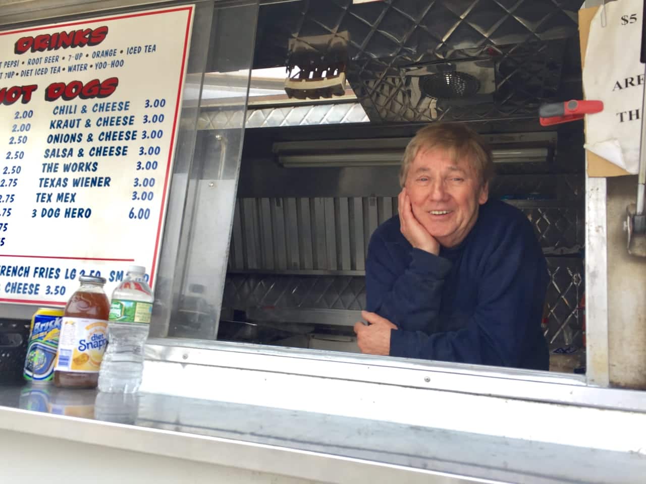 Mark Butler waits in Mark's Hot Dog truck in Bergenfield for his next customer.