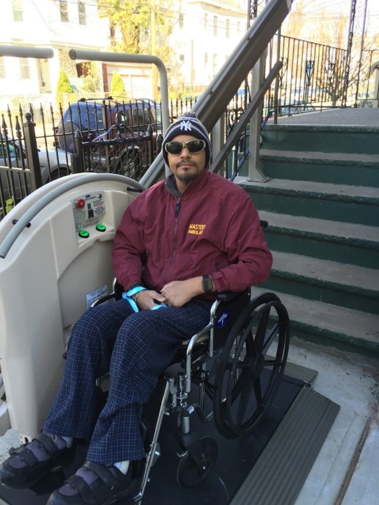 Conrado Bermudez of Paterson tries out his new chair lift, donated by Handi-Lift, Inc. in Carlstadt. The donation and connections to contractors were arranged through Giants of Generosity in Cresskill.