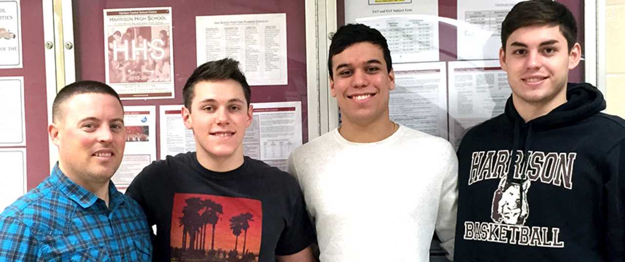 Harrison High School seniors Zach Evans, Michael Nannariello and Jack Witte received honorable mention in Westchester's Golden Dozen are pictured with coach Dominic Zanot.