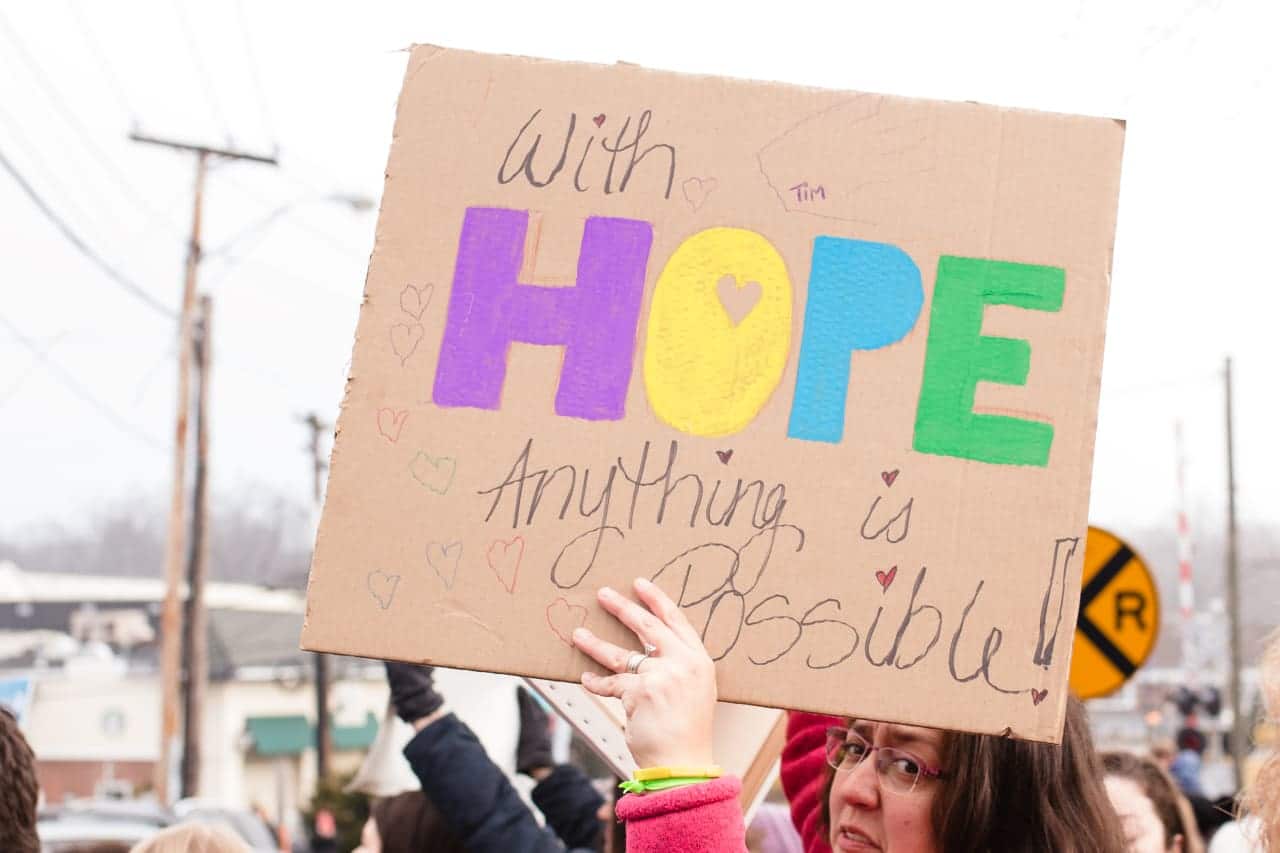 A participant holds a sign during the peaceful rally in Wyckoff organized by Women for Progress.