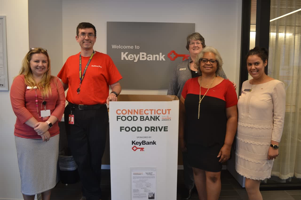 Employees at the KeyBank New Haven Branch prepare for the Connecticut Food Bank food drive.