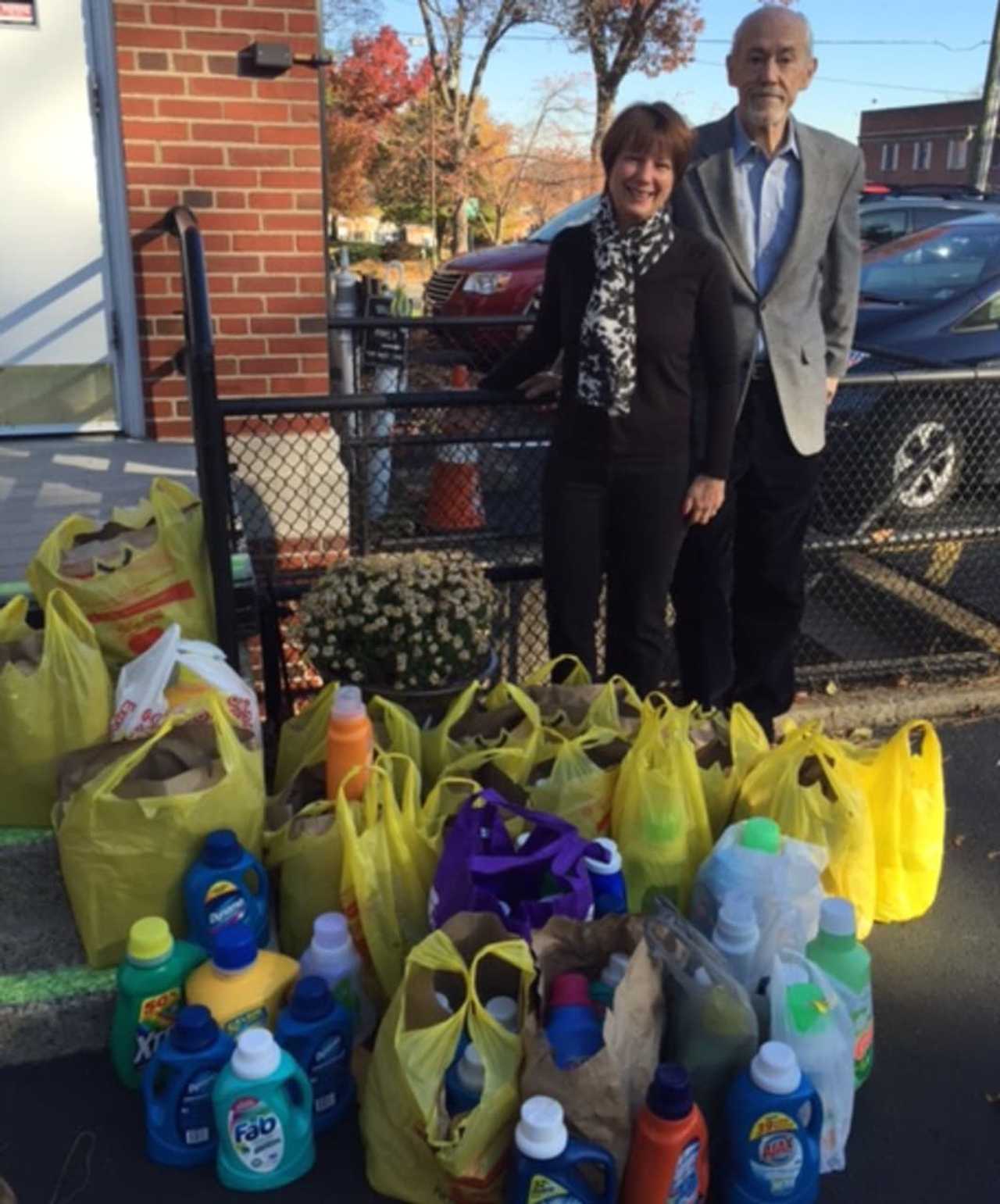 Kate Duggan, Executive Director of Family Promise Bergen County, received from Northern New Jersey Community Foundation's President, Michael Shannon, the Foundation's collection of laundry detergent for homeless families.