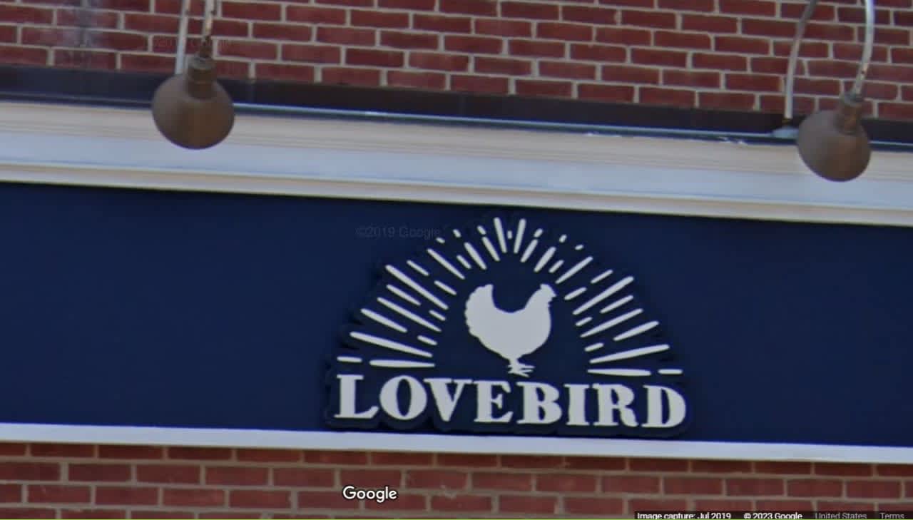 A Lovebird storefront sign
