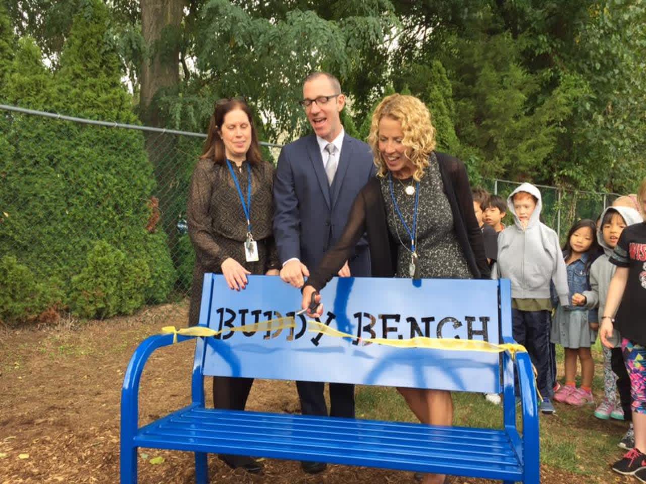 Mrs. Alberti, Principal DeLaura and Superintendent Gross at Norwood School's Buddy Bench ribbon cutting.