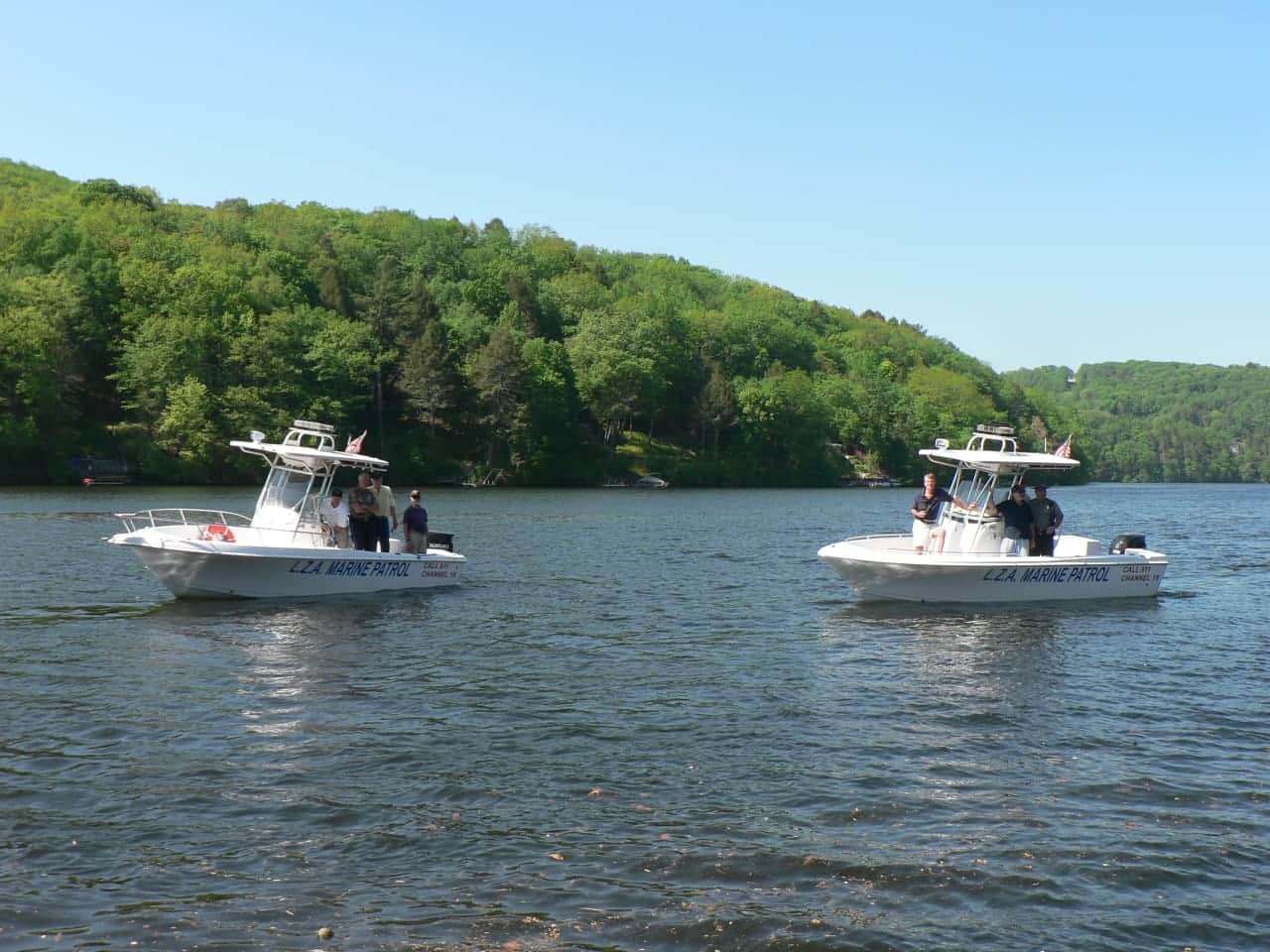 Two police boats patrol Lake Zoar. The growth of algae in the water depends on the summer weather.