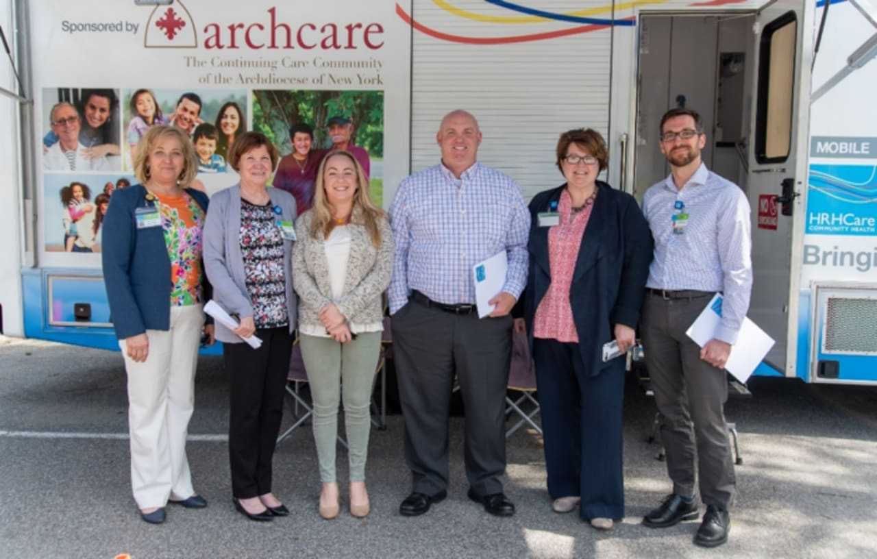 Assemblyman Lalor with HRHCare Chief Operating Officer Allison Dubois and HRHCare staff.