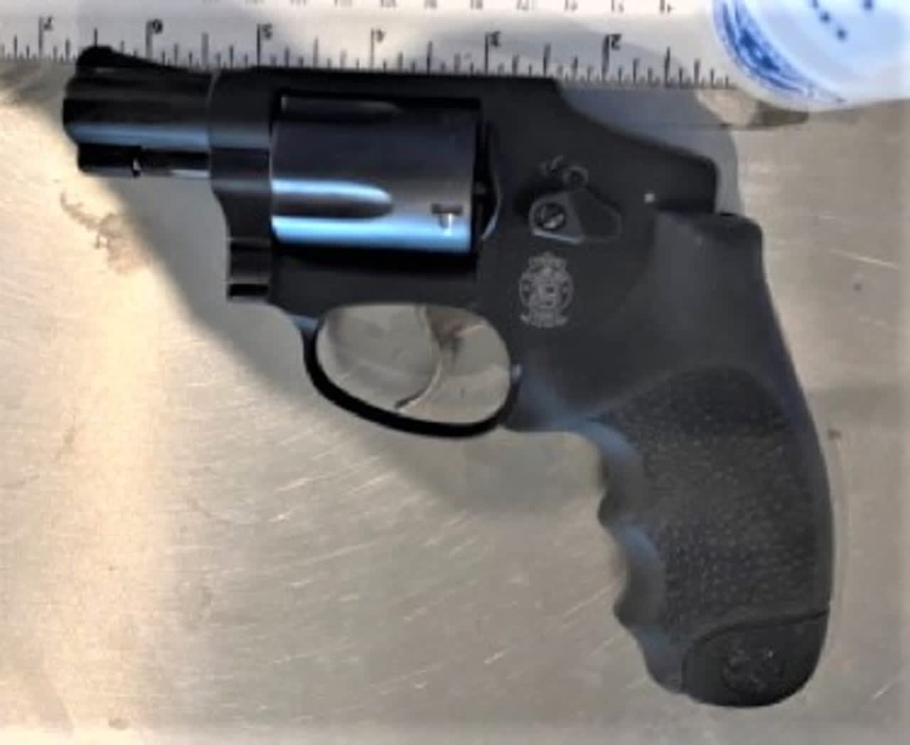 A woman was arrested after officials said she tried to board a flight at LaGuardia Airport with a loaded revolver.