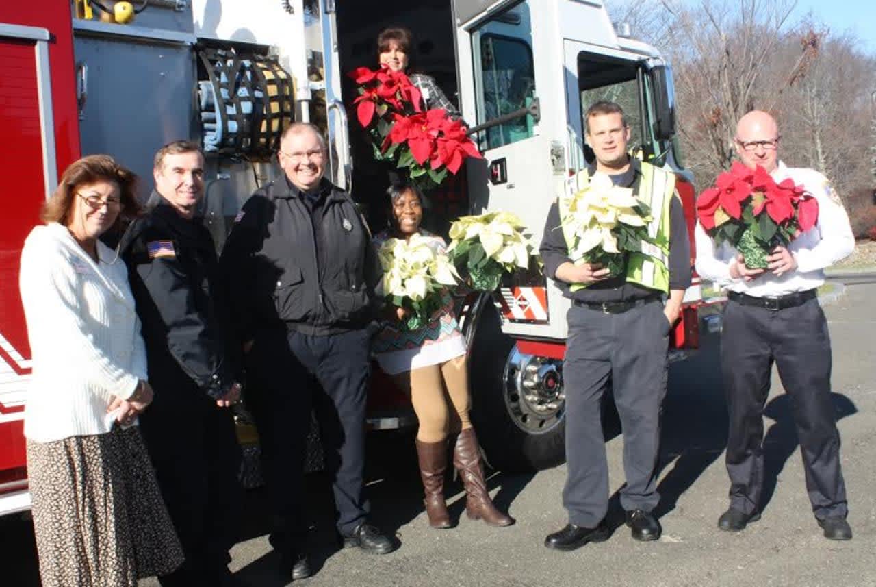 New Canaan Fire Department delivered poinsettas to help celebrate the holidays at Waveny LifeCare in New Canaan. 