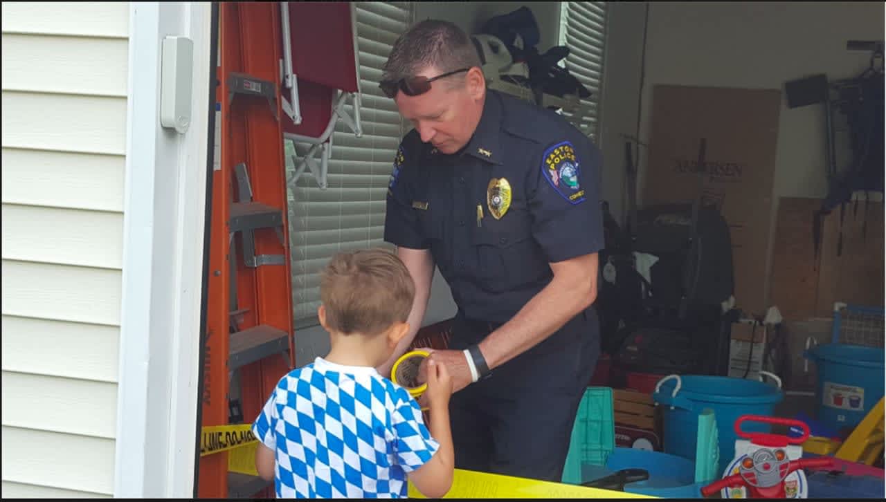 Easton Police Department Chief Tim Shaw with a preschool student.