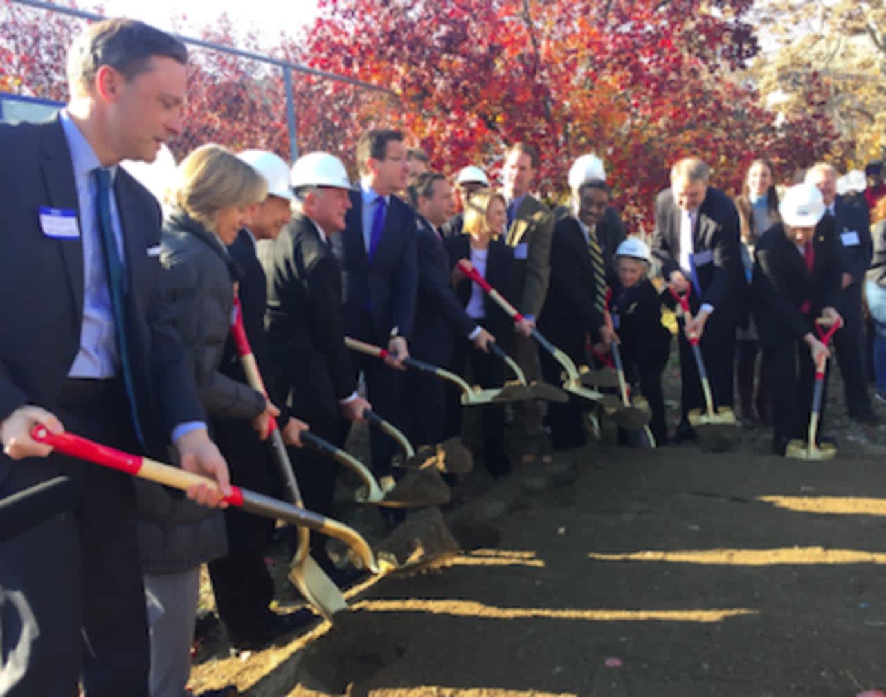 Gov. Dannel P. Malloy, center, at the groundbreaking ceremony or the Washington Village Redevelopment Project on Monday.