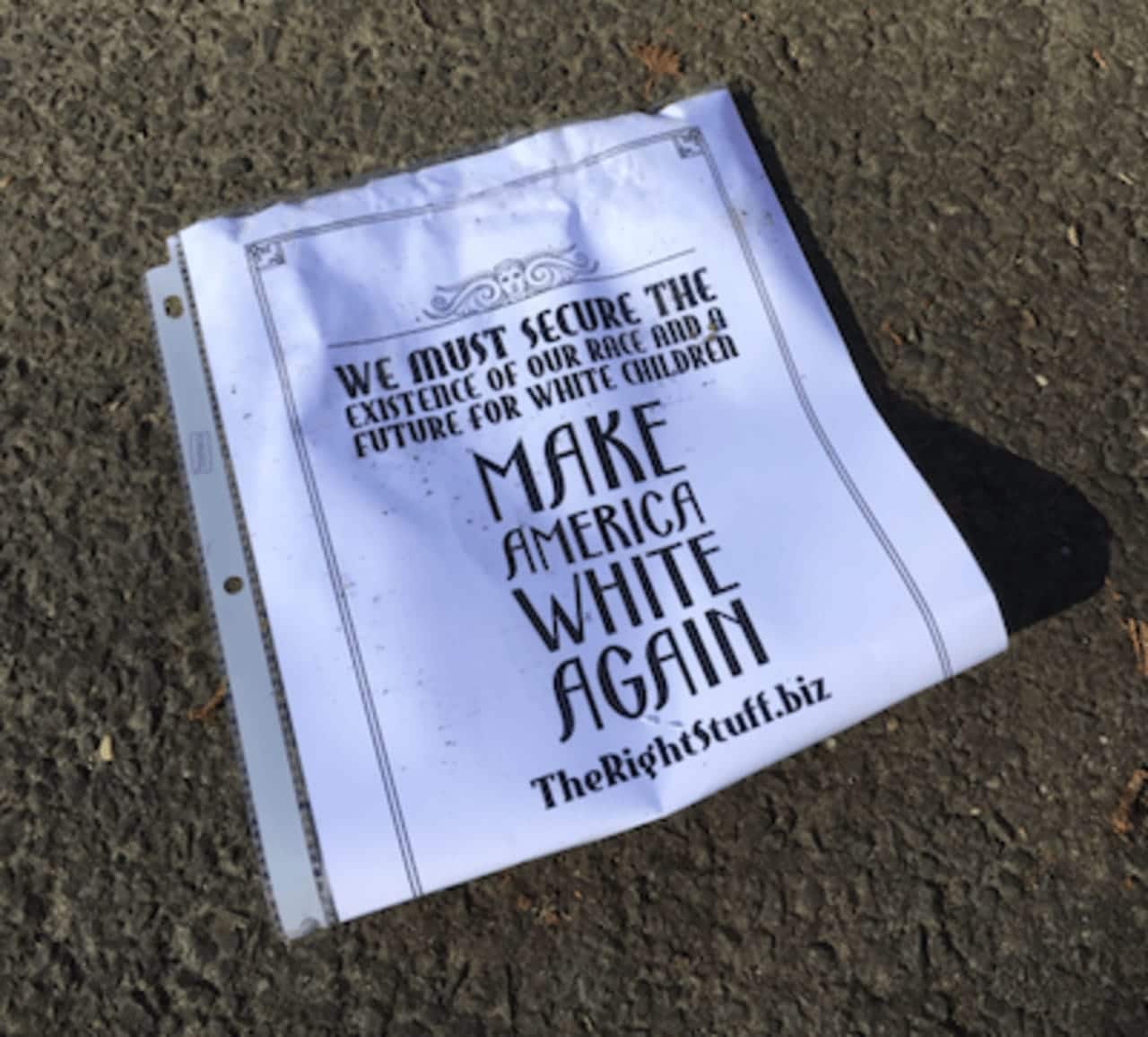 One of five white supremacist fliers found in driveways on Newtown Avenue on Monday morning. Norwalk Police are investigating.