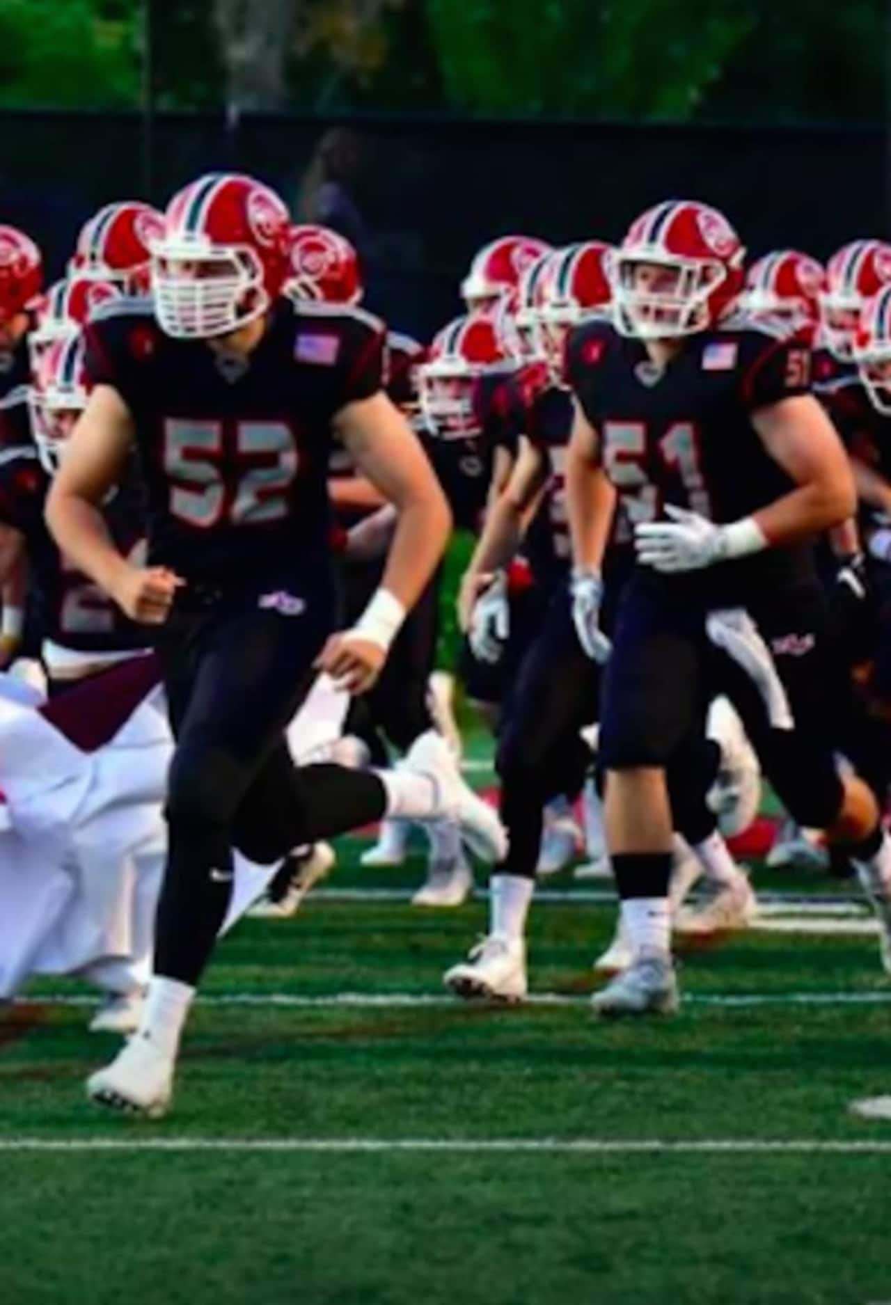 The New Canaan Rams shut out the Darien Blue Wave in the annual Turkey Bowl matchup.