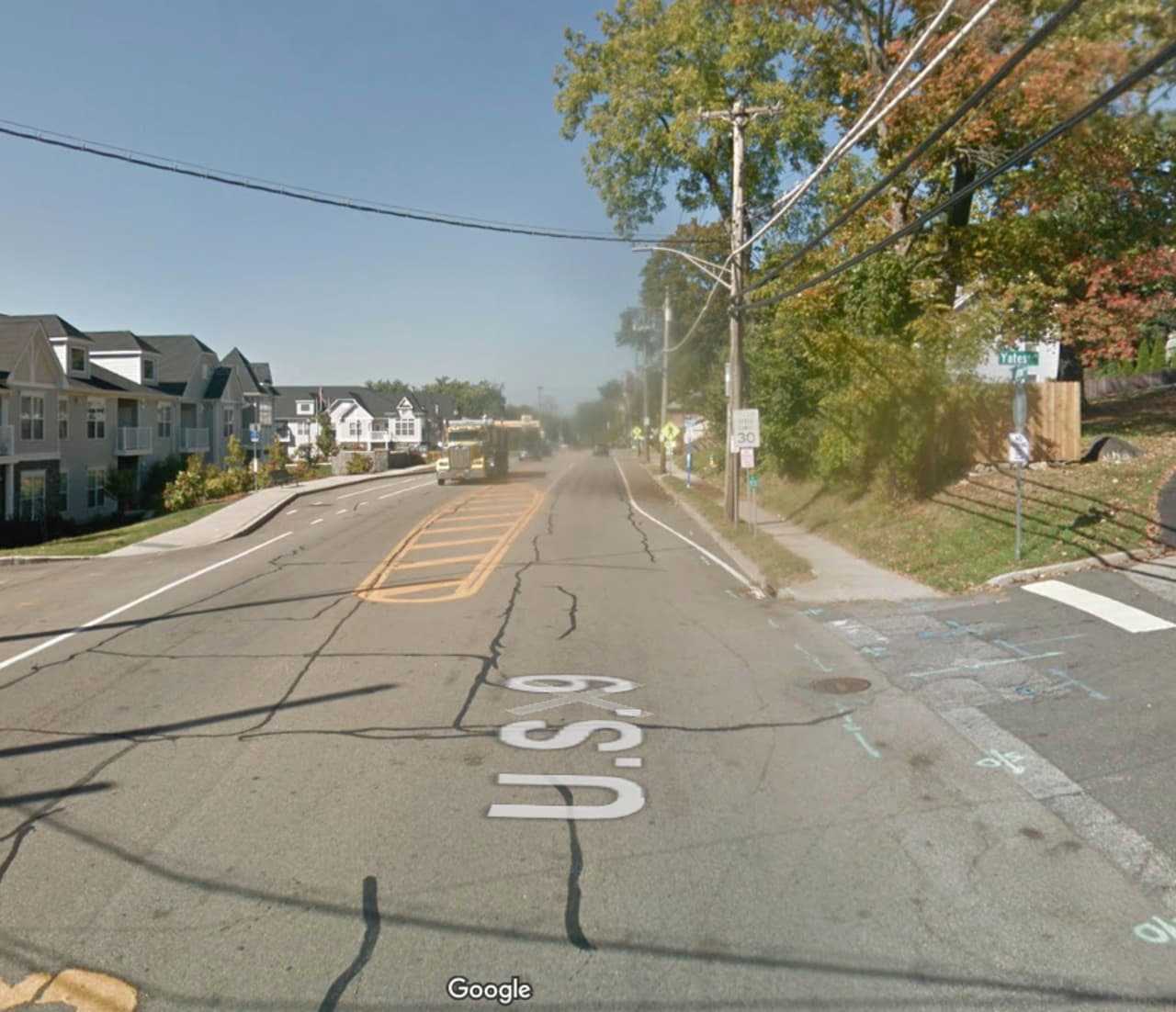 A person is trapped under a tree in Ossining.