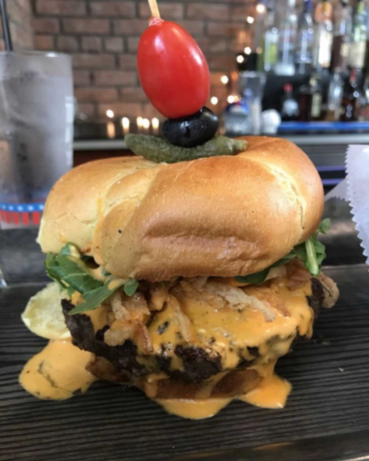 "The Train Wreck" (spicy blue cheese, frizzled onions and arugula on brioche) from Westchester Burger Co., which is opening a new location in Scarsdale on Monday, Oct. 7.