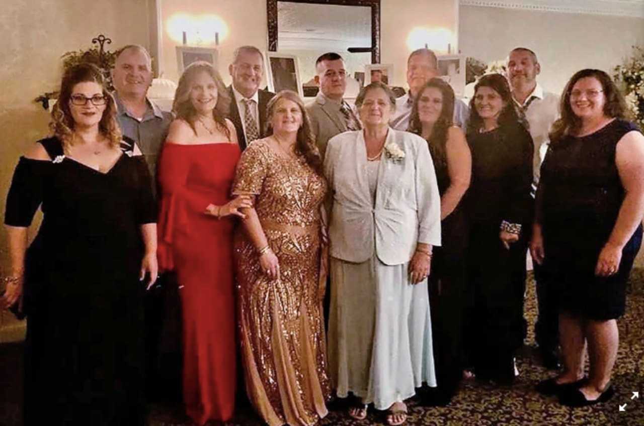 Grace Fusco, center, with her 11 children.