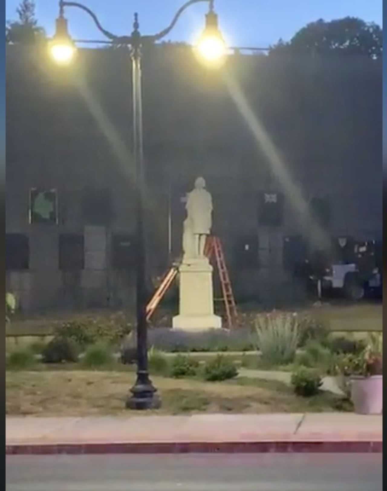 Workers set-up to remove the Christopher Columbus statue in Norwalk.