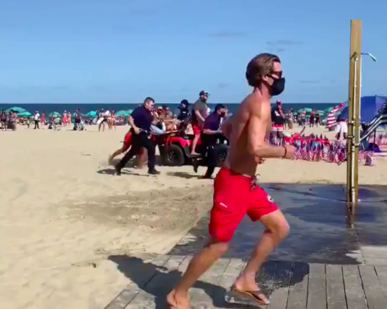 Lifeguards and police rush to a double stabbing at Jenkinson's Beach in Point Pleasant Beach.