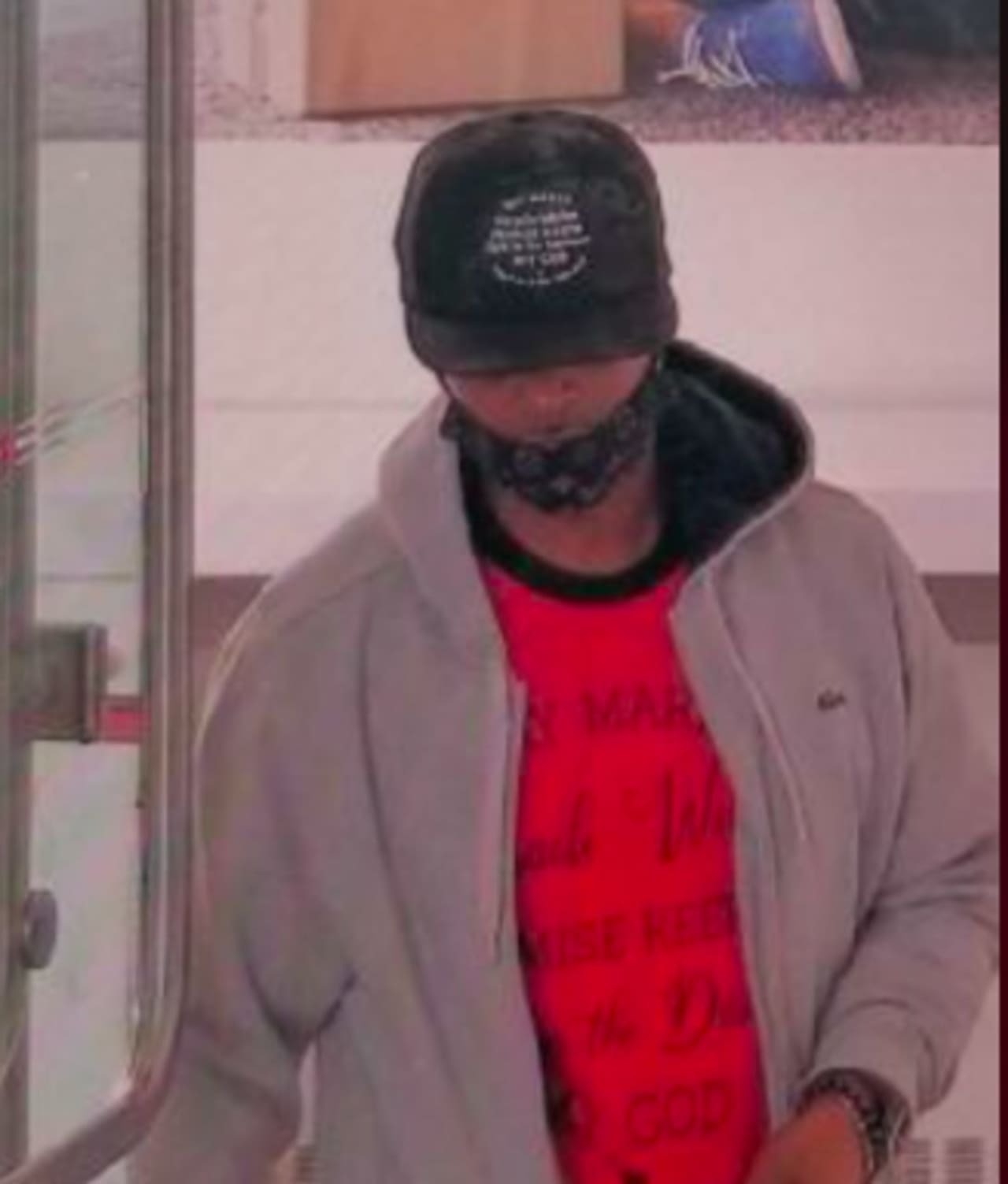 This man is accused of spitting in the face of a bank worker who asked him to adjust his face mask.