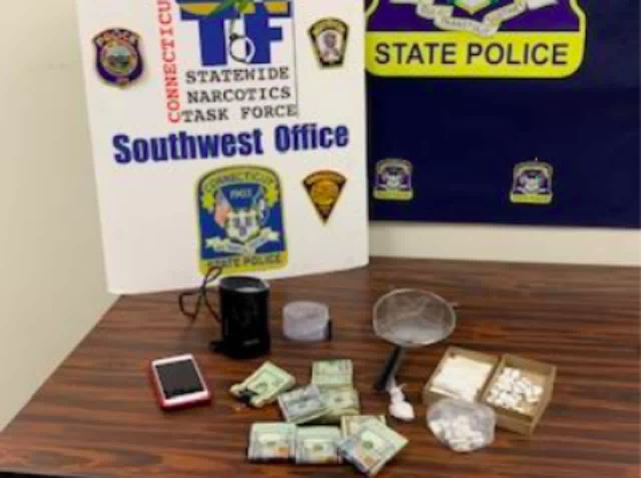A photo of the confiscated cash and narcotics.