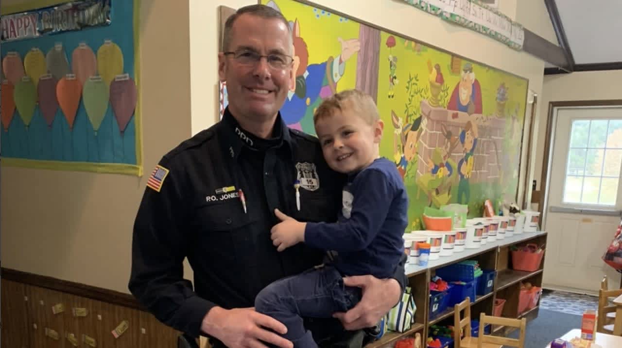 Peekskill Police Officer Gregory Jones pictured with his 3-year-old son.