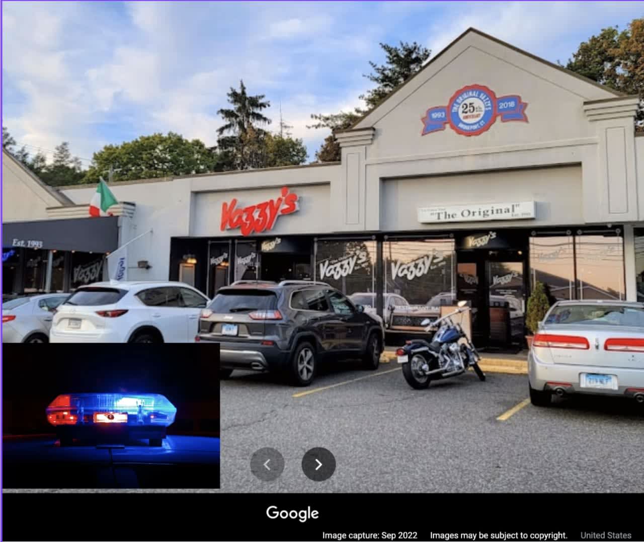 Two armed men forced an employee at gunpoint to open the restaurant so they could rob it.