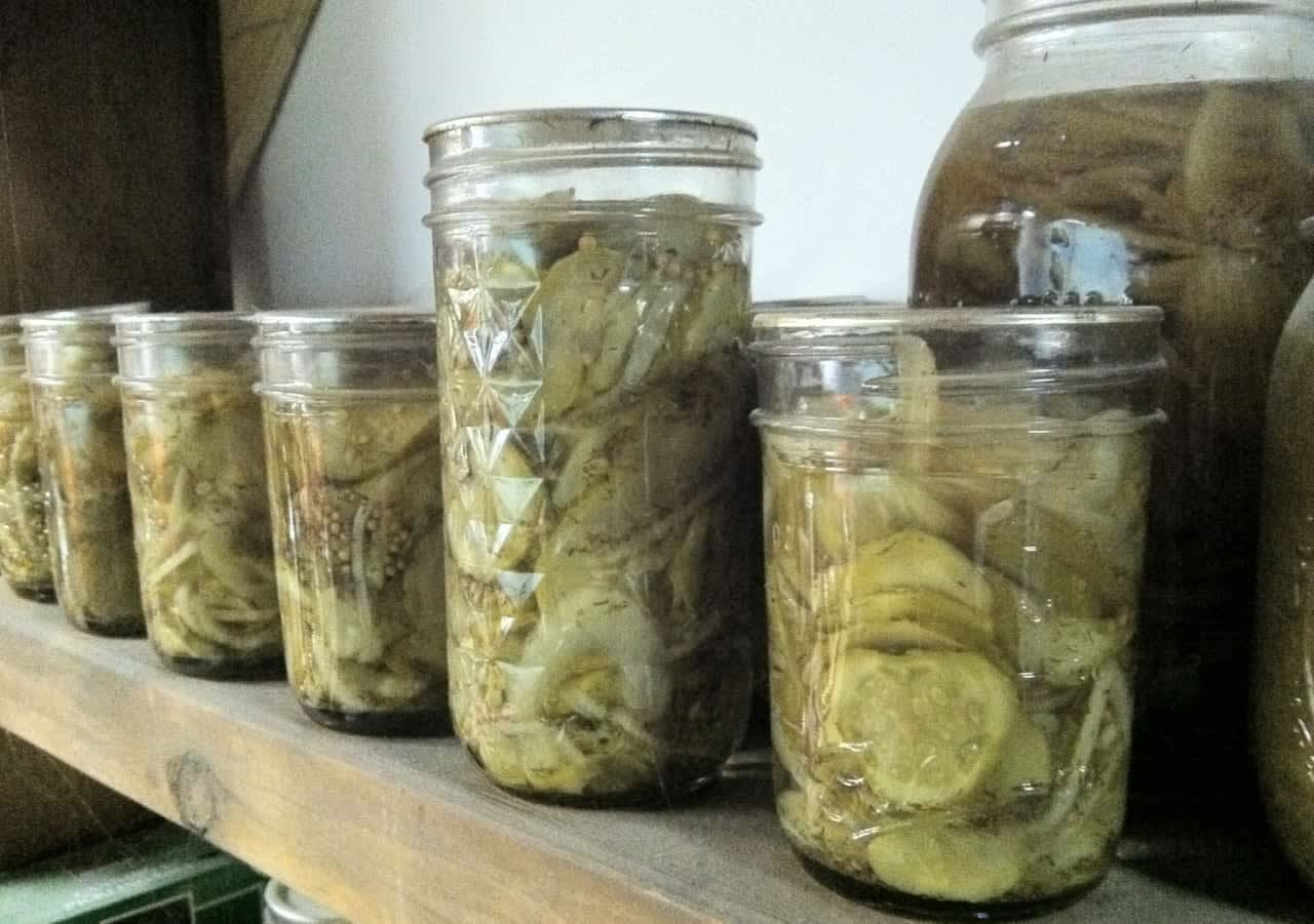 Mason jars full of pickles.