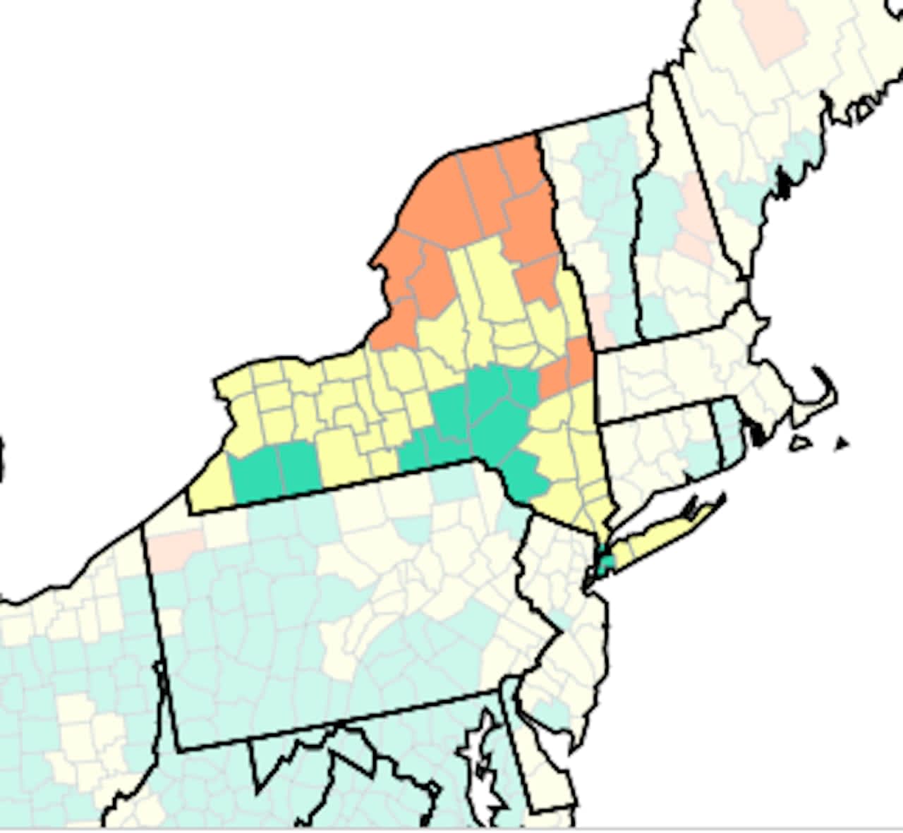 Counties shown in orange are where the CDC advises wearing masks indoors. Yellow counties are places in which those at high risk for severe disease should be cautious, and in green counties, indoor masking is not necessary.