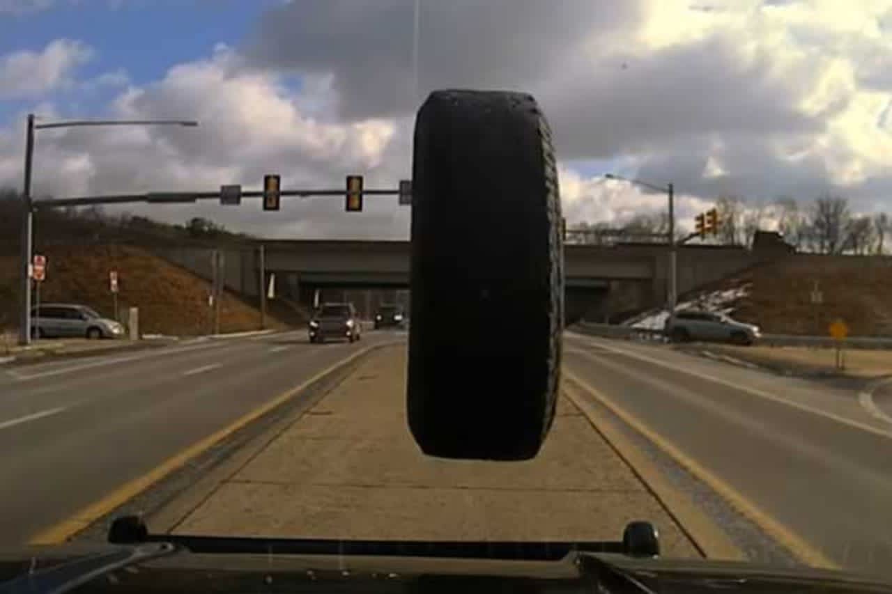 A tire flying into the window of a police vehicle in Pennsylvania.