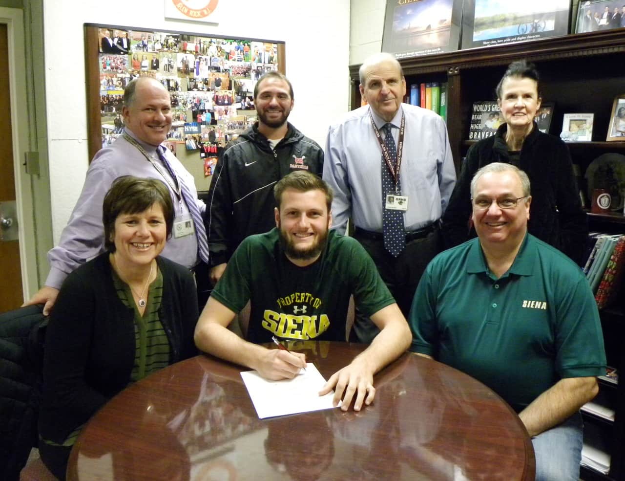 Glen Rock High School senior Tommy Pulzello is joined by his parents Mary Jane and Fred Pulzello as he signs his commitment letter to play Division 1 lacrosse for Siena College in New York. 