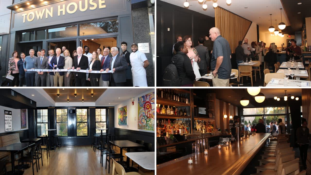 New Rochelle city officials celebrate the grand opening of the Town House restaurant at 559 Main St. with a ribbon-cutting ceremony followed by a sampling of the restuarant's cuisine.