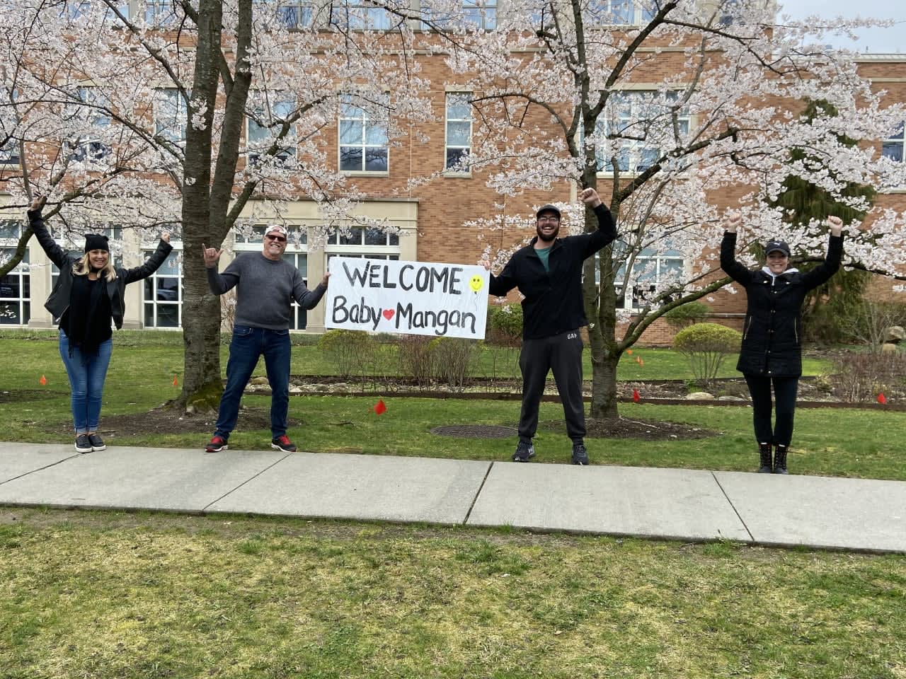 Family members from Long Island gathered outside Greenwich Hospital to celebrate the birth of Myles Mackenzie Mangan during the COVID-19 pandemic.