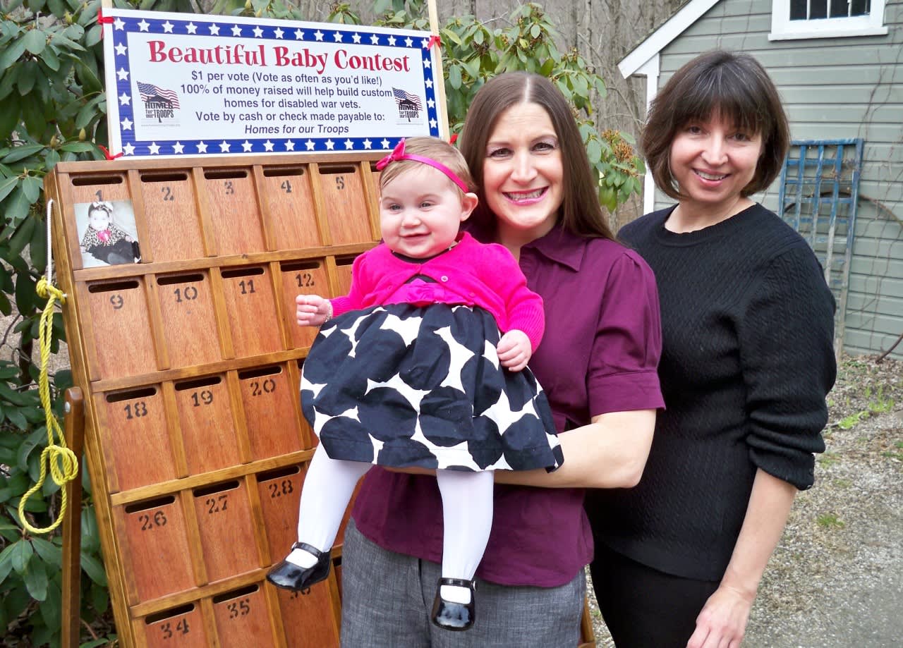 Lois Barber is preparing to hold her annual Beautiful Baby Contest. Funds raised from the contest go to build "smart houses" designed to help improve the lives of wounded veterans.