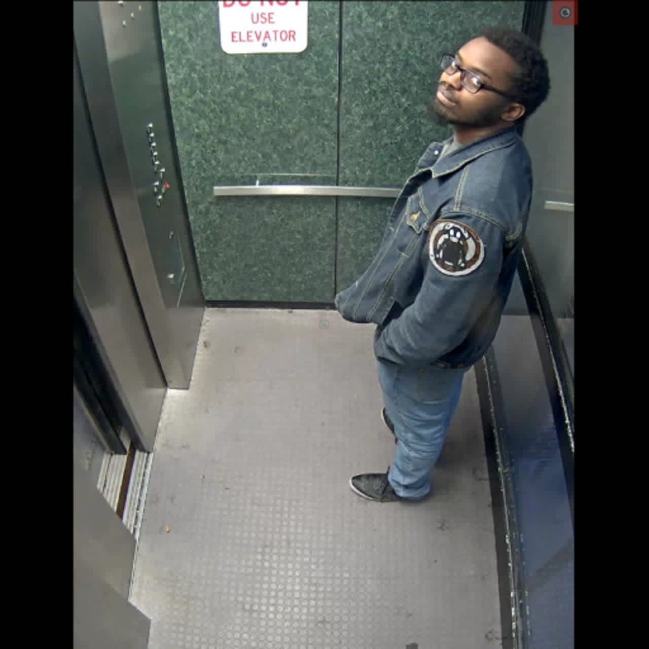 Still from CCTV of a man who allegedly pooped in a public stairwell of a Carlisle parking garage.