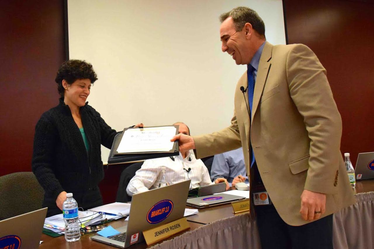 Briarcliff Manor Superintendent of Schools James Kaishian presents Board of Education Trustee Jennifer Rosen with a certificate recognizing her achievement as a Master of Boardsmanship from the New York State School Boards Association.